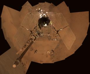 This mosaic of images was taken by NASA's Mars Exploration Rover Opportunity during December of 2011. The accumulation of dust reduces the rover's power supply, and the rover's mobility is limited until the winter is over or wind cleans the panels.