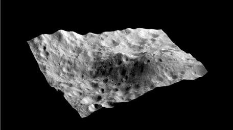 This still from a movie shows an image taken by NASA's Dawn spacecraft layered on a digital terrain model of an unusual hill containing a dark-rayed impact crater and nearby dark deposit on asteroid Vesta.