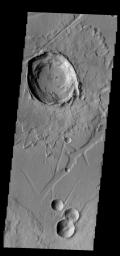 The relatively young Canala Crater and its ejecta overlie the tectonic structures of Labeatis Fossae as seen by NASA's 2001 Mars Odyssey spacecraft.