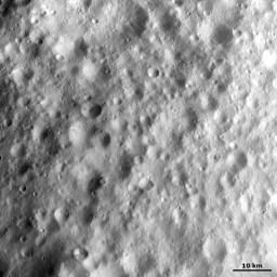 This image from NASA's Dawn spacecraft shows heavily cratered terrain in asteroid Vesta's equatorial region. The craters have a wide range of sizes and many different forms, which include fresh, degraded and barely visible because they are so degraded.