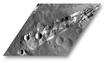 This image from NASA's Dawn spacecraft shows Dawn visible and infrared spectrometer image, overlain on top of a framing camera image of the same region on asteroid Vesta.