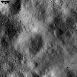 This image from NASA's Dawn spacecraft shows impact ejecta deposits dominating asteroid Vesta's landscape. This impact ejecta material was ejected from an impact crater located outside the imaged area.