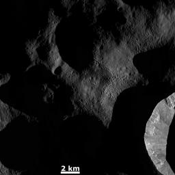 This image from NASA's Dawn spacecraft shows the sun illuminating the landscape of asteroid Vesta during a Vestan 'sunrise'; the sun had a low angle relative to Vesta's surface, just as the sun has a low angle in the sky in the morning on Earth.