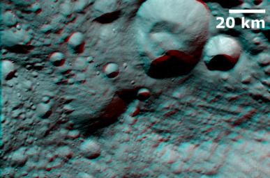 This anaglpyh from NASA's Dawn spacecraft shows Caparronia crater on asteroid Vesta. The 3-D effect of the anaglyph highlights the large ridge running across the base of Caparronia crater. You will need 3-D glasses to view this image.