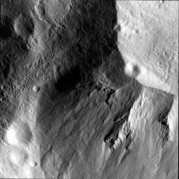 This image from NASA's Dawn spacecraft shows a close-up view of the wall of the Rheasilvia impact basin on asteroid Vesta.