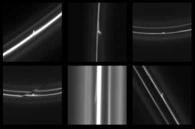 This image obtained by NASA's Cassini spacecraft shows trails that were dragged out from Saturn's F ring by objects about a half mile (1 kilometer) in diameter.