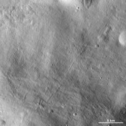 This image of asteroid Vesta from NASA's Dawn spacecraft shows a particularly smooth part of the giant asteroid's surface, likely covered in fine-grained regolith material.