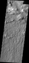 This image captured by NASA's 2001 Mars Odyssey spacecraft shows the southern rim of Lockyer Crater and part of its ejecta blanket.