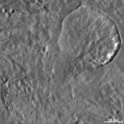 This image from NASA's Dawn spacecraft of asteroid Vesta shows Aquilia crater located in Pinaria quadrangle, in Vesta's southern hemisphere. The especially degraded bottom rim was probably formed by debris slumping into the crater.
