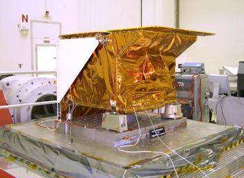 Technicians install NASA's Tropospheric Emission Spectrometer (TES) instrument on NASA's Aura spacecraft prior to launch in July 2004.