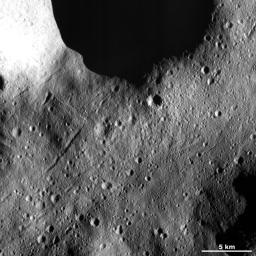 This image from NASA's Dawn spacecraft of asteroid Vesta shows many secondary crater chains on Vesta's surface. This image is located in Vesta's Domitia quadrangle, in Vesta's northern hemisphere.