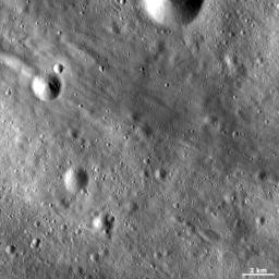 This image from NASA's Dawn spacecraft shows linear grooves and ridges in Vesta's regolith, located in Vesta's Tuccia quadrangle, in asteroid Vesta's southern hemisphere.