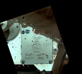 This view of Curiosity's deck shows a plaque bearing several signatures of US officials, including that of President Obama and Vice President Biden. The image was taken by the rover's Mars Hand Lens Imager (MAHLI).