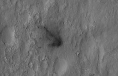 This close-up view captured by NASA's Mars Reconnaissance Orbiter shows darkened radial jets caused by the impact of Curiosity's sky crane, which helped deliver the rover to the surface of Mars.