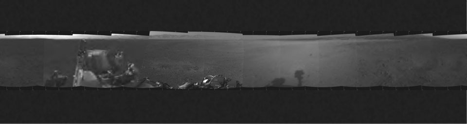 This is the first 360-degree panoramic view from NASA's Curiosity rover, taken with the Navigation cameras. Mount Sharp is to the right, and the north Gale Crater rim can be seen at center. The rover's body is in the foreground.