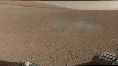 This is a portion of the first color 360-degree panorama from NASA's Curiosity showing the rover's a mountain at the center of Gale Crater called Mount Sharp, can be seen in the distance, to the left, beginning to rise up.