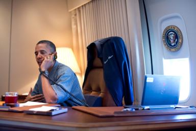 President Barack Obama talks on the phone with NASA's Curiosity Mars rover team aboard Air Force One during a flight to Offutt Air Force Base in Nebraska, Aug. 13, 2012. (Official White House Photo by Pete Souza)
