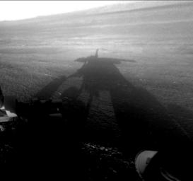 NASA's Mars Exploration Rover Opportunity captured this view of its afternoon shadow stretching into Endeavour Crater during the 3,051st Martian day, or sol, of Opportunity's work on Mars (Aug. 23, 2012).