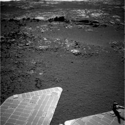 The team operating NASA's Mars Exploration Rover Opportunity plans to investigate rocks in this area. Both the dark fins and the paler outcrop beyond them hold potential targets for studying with instruments on the rover.