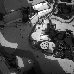 This image from NASA's Curiosity rover shows the inlet covers for the Sample Analysis at Mars instrument as the rover continues to check out its instruments in the first phase after landing.