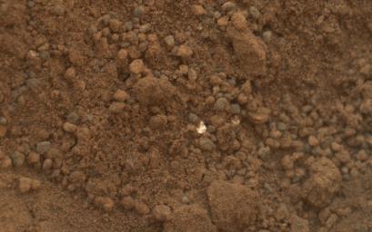 The mission's science team assessed the bright particles in this scooped pit to be native Martian material rather than spacecraft debris as seen in this image from NASA's Mars rover Curiosity as it collected its second scoop of Martian soil.