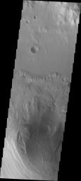 This image from NASA's Mars Odyssey spacecraft shows the northern part of Mt. Sharp and the crater floor between Mt. Sharp and the northern rim of Gale Crater. The layering of Mt. Sharp is visible at the bottom of the image.