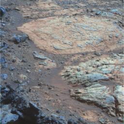 A rind that appears bluish in this false-color view covers portions of the surface of a rock called 'Whitewater Lake' in the top half of the view from NASA's Mars Exploration Rover Opportunity.