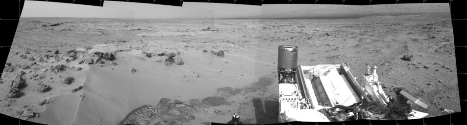 NASA's Mars rover Curiosity drove 6.2 feet (1.9 meters) during the 100th Martian day, or sol, of the mission (Nov. 16, 2012). The view spans from north at the left to south-southeast at the right. It is presented in a cylindrical projection.