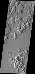 The hills and mesas in this image seen by NASA's 2001 Mars Odyssey spacecraft are part of Echus Chaos.