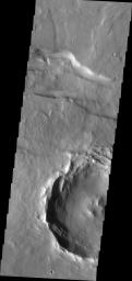 This image from NASA's 2001 Mars Odyssey spacecraft shows a small portion of a east/west trending fracture in Thaumasia Planum on Mars.