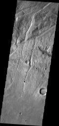 This image from NASA's 2001 Mars Odyssey spacecraft of the Claritas Fossae region illustrates how fractures affect other features. In this instance, the fractures control the path of several channels (from upper right towards lower left).