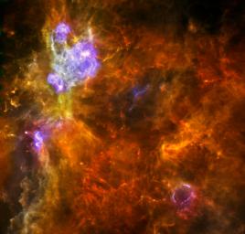 W3 is an enormous stellar nursery about 6,200 light-years away in the Perseus Arm, one of the Milky Way galaxy's main spiral arms as seen by ESA's Herschel space observatory.