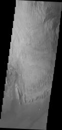 This image captured by NASA's 2001 Mars Odyssey spacecraft shows more of the weathering of the eastern side of Mt. Sharp.
