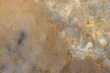 NASA's rover Curiosity appears as a bluish dot near the lower right corner of this enhanced-color view from the HiRISE camera on NASA's Mars Reconnaissance Orbiter.