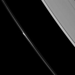 This image, taken by NASA's Cassini spacecraft, shows A beautiful 'mini-jet' appearing in the dynamic F ring of Saturn. Saturn's A ring (including the Keeler gap and just a hint of the Encke gap at the upper-right) also appears.