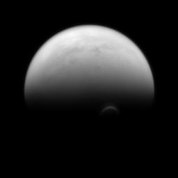 The sunlit edge of Titan's south polar vortex stands out distinctly against the darkness of the moon's unilluminated hazy atmosphere as seen by NASA's Cassini spacecraft.