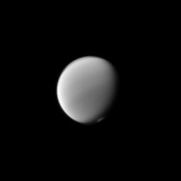 Titan's atmosphere puts on a display with the detached haze to the north (top of image) and the polar vortex to the south as seen by NASA's Cassini spacecraft.