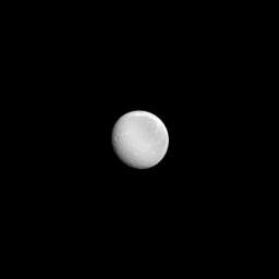 A nearly full Rhea shines in the sunlight in this image from NASA's Cassini spacecraft. Rhea (949 miles, or 1,527 kilometers across) is Saturn's second largest moon.