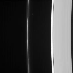 Saturn's moon Prometheus orbits near some of its handiwork in the F ring in this image from NASA's Cassini spacecraft. Prometheus and its partner Pandora gravitationally sculpt and maintain the narrow F ring.