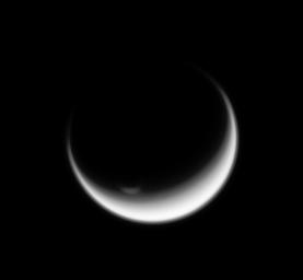 Titan's polar vortex stands illuminated where all else is in shadow in this image from NASA's Cassini spacecraft.