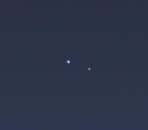 The cameras on NASA's Cassini spacecraft captured this rare look at Earth and its moon from Saturn orbit on July 19, 2013. The image has been magnified five times.