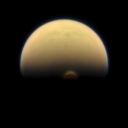 Slipping into shadow, the south polar vortex at Saturn's moon Titan still stands out against the orange and blue haze layers that are characteristic of Titan's atmosphere. Images like this, from NASA's Cassini spacecraft.