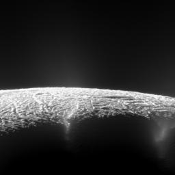 This dramatic view from NASA's Cassini spacecraft looks across the region of Enceladus' geyser basin and down on the ends of the Baghdad and Damascus fractures that face Saturn.