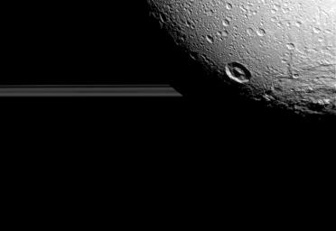 Saturn's moon Dione hangs in front of Saturn's rings in this view taken by NASA's Cassini spacecraft during the inbound leg of its last close flyby of the icy moon.