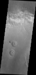 This image from NASA's Mars Odyssey spacecraft shows martian terrain that resemble a set of 'surprised' eyeballs.