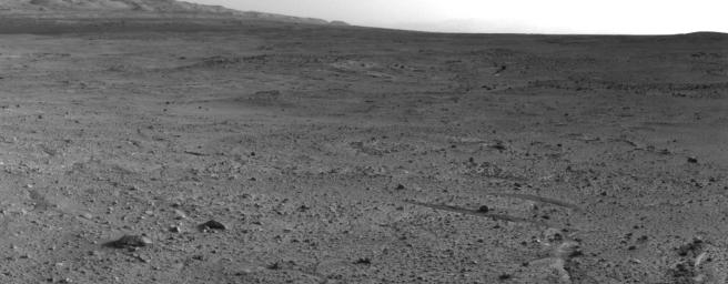 In the upper central portion of this image is a patch of ground paler than its surroundings as seen by NASA's Mars rover Curiosity after reaching the top of a rise called 'Panorama Point.'