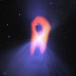 The Boomerang nebula, called the 'coldest place in the universe,' reveals its true shape to the Atacama Large Millimeter/submillimeter Array (ALMA) telescope. The background blue structure, is seen in visible light by NASA's Hubble Space Telescope.