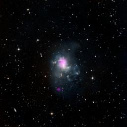 The magenta spots in this image from NASA's NuSTAR show two black holes in the spiral galaxy called NGC 1313, or the Topsy Turvy galaxy, located about 13 million light-years away in the Reticulum constellation.