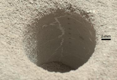 The hole that NASA's Curiosity Mars rover drilled into target rock 'John Klein' provided a view into the interior of the rock, as well as obtaining a sample of powdered material from the rock.