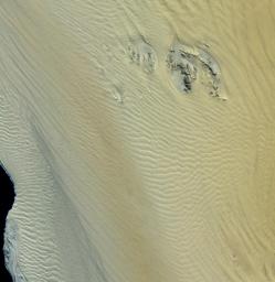 This image, acquired by NASA's Terra spacecraft, shows the Namib Desert, a coastal desert in southern Africa. This portion in central Namibia consists entirely of linear and longitudinal sand dunes.